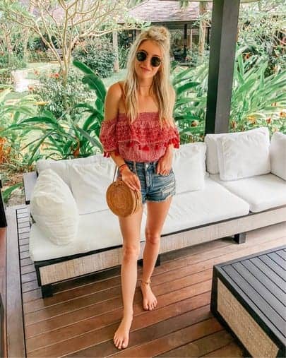 red gingham tassel crop top and round rattan bag