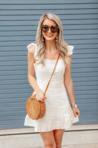 White Ruffle Dress with Round Rattan Bag