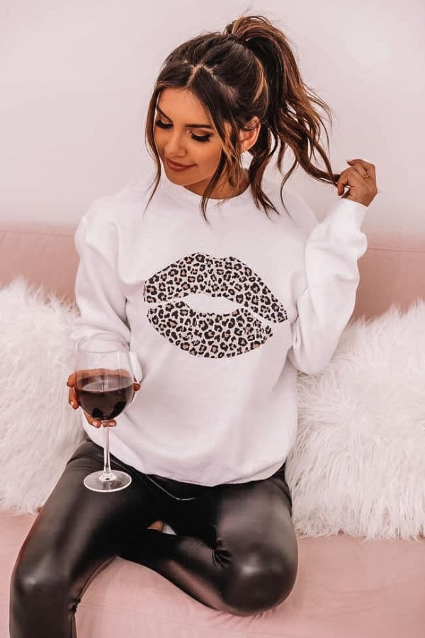 valentines day, Valentine's Day outfits, valentines outfits, valentines outfit ideas, valentines day outfits, valentines day outfits for women, valentines day outfits date, casual outfit women, kiss sweater outfit, leopard sweater, leggings outfit, faux leather leggings outfit